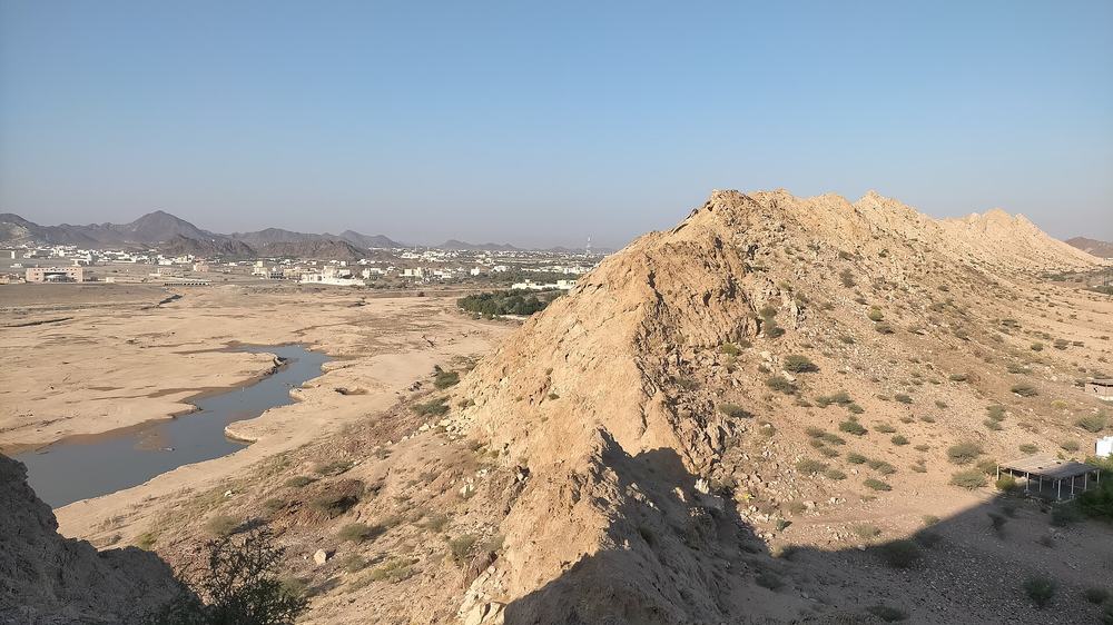 Jabal Laim — Masfut - Panoramic view of Jabal Laim (420 m) and the Wadi Hadf Dam reservoir.jpg