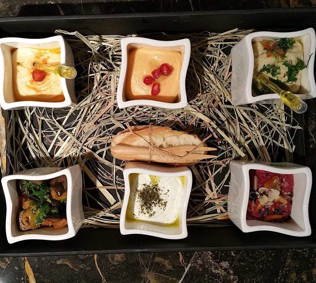 Welcome to Dubai — My kind of #welcome @theritzcarlton #dubai IFC where an Arabic #mezze plate of dips, olives & #healthy #treats greets us on arrival. #yummy #travel # hospitality #rules